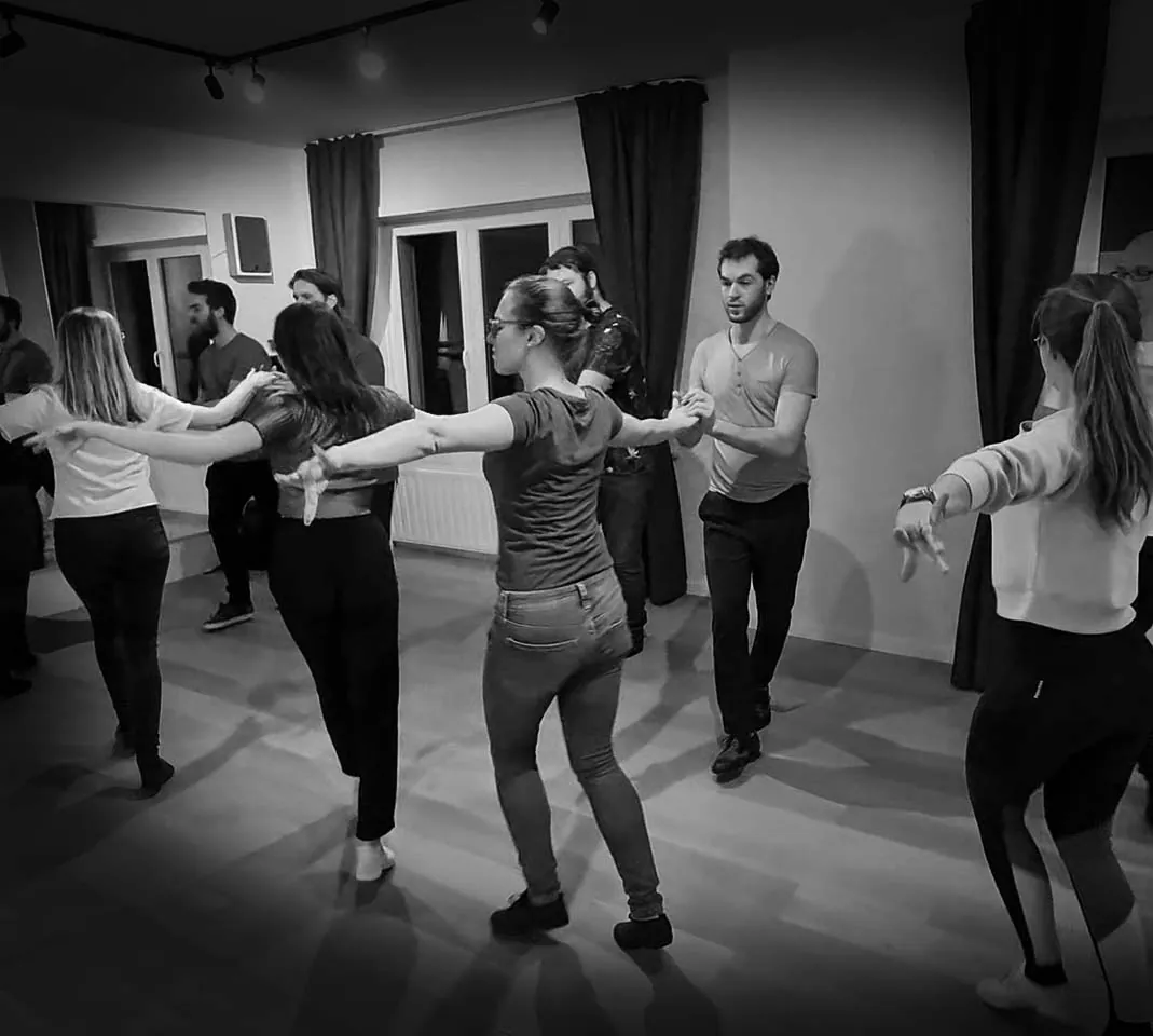 A dancer working on styling during a Bachata class